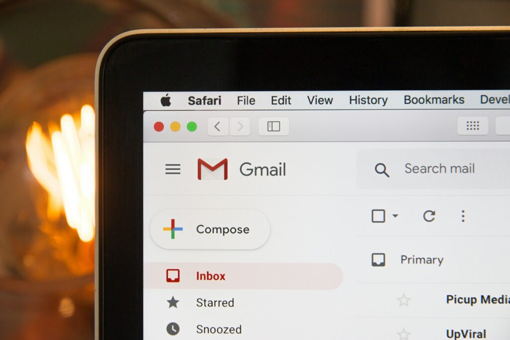 black laptop computer featuring a view of gmail in a browser