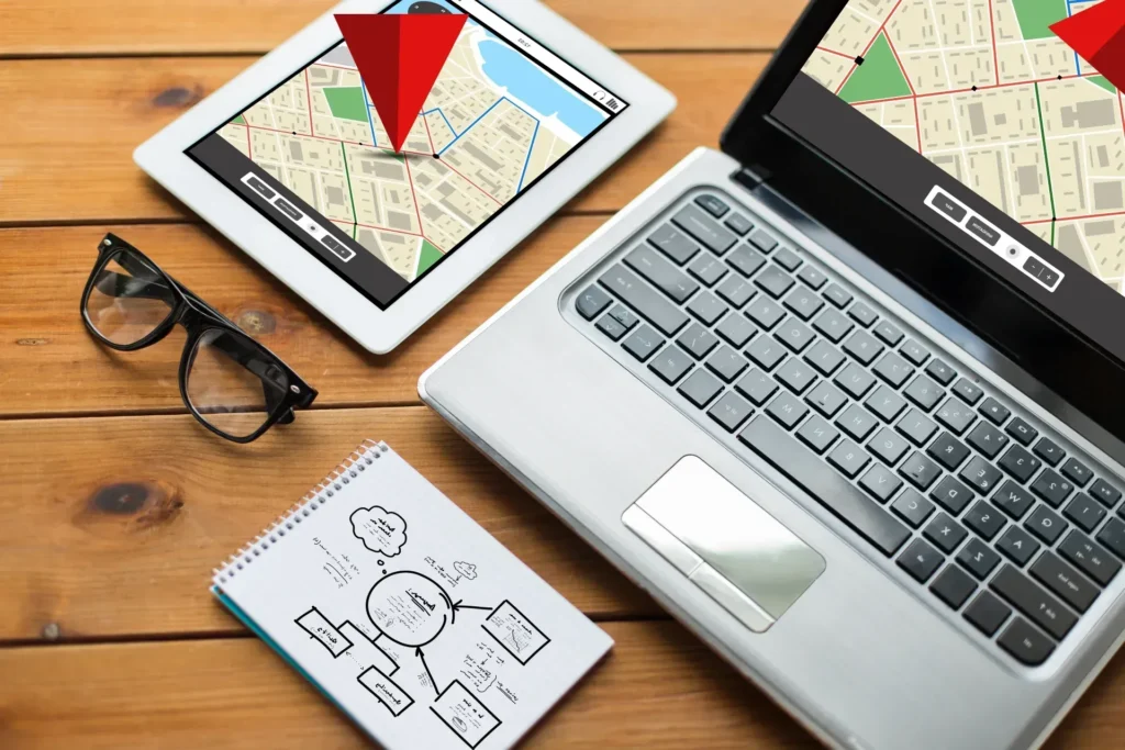 Laptop and tablet with maps search results indicated